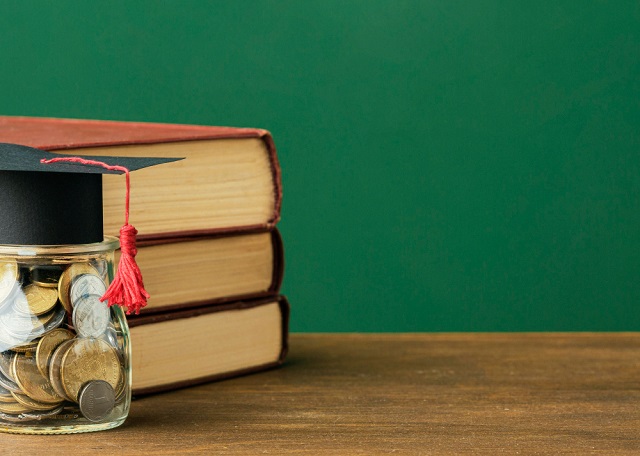 Scholarship Points – Meaning and How to Maximize Scholarship Points and Get a Scholarship; Watch Video and Images: Scholarship Images/Photos: 1. A free photo front view  of stack of books with copy space and a graduation cap on a  jar of coins representing scholarship points meaning. Image credit: Freepik. https://www.freepik.com/free-photo/front-view-stack-books-with-copy-space-jar-coins_11152461.htm#