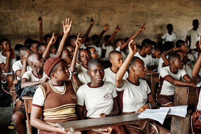 Education Levels in Nigeria Photos: 1. A photo of a cross-section of secondary school students learning in a classroom. Photo by Emmanuel Ikwuegbu on Unsplash