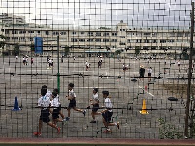 Public Schools Images/Photos: 2. A photo of a group of children playing in the school yard of a middle school in Tokyo, Japan. Photo by Xavier Wateva on Unsplash