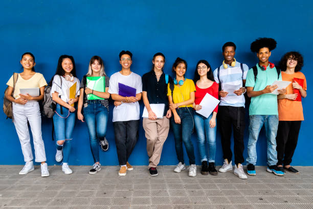 Public School Students Images/Photos: 1. Photo of a group of public school students posed for a picture in a school building. Photo credit: iStock. https://media.istockphoto.com/id/1419246153/photo/group-of-multiracial-teenage-high-school-students-looking-at-camera-standing-on-blue.jpg?s=612x612&w=0&k=20&c=GkX9HtjcT97OLLhge8XjYYDs8NqxO2nK5Mo-Sr4eBt8=