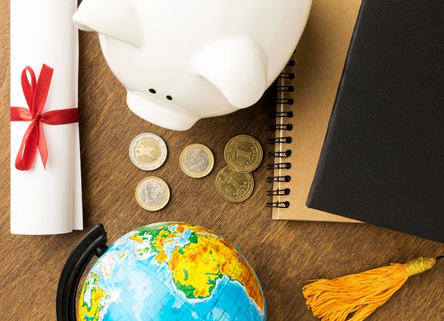 Scholarship vs Financial Aid vs Fellowship vs Grant Photo: 3. An illustrative photo of how different forms of education funding differs. Photo credit: Freepik. https://www.freepik.com/free-photo/top-view-piggy-bank-with-notebooks-diploma_11152989.htm#