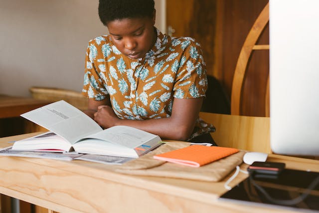 Secondary School Students Scholarships Images/Photos: 3. A secondary school student studying in a classroom. Photo by RF._.studio: https://www.pexels.com/photo/photo-of-woman-reading-books-3059654/