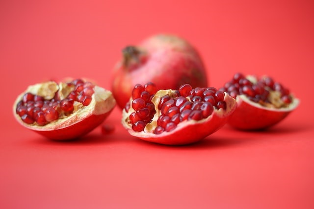Image of red-coloured pomegranates. Pomegranates are also rich in antioxidants - a unique antioxidant called punicalagin. Pomegranates are a good source of polyphenols, which are plant compounds that have been linked to numerous health benefits, including reduced inflammation and improved heart, skin and digestive health.and anti-cancer properties.
