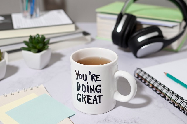 Free photo inspirational quote written on mug of coffee