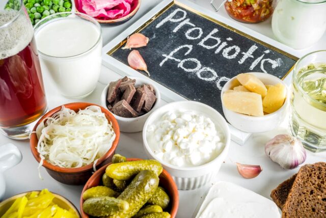 Image of Natural Probiotic Foods. Fermented dairy probiotics include yogurt, kefir, and certain cheeses, while non-dairy options include kimchi, kombucha, miso, and sauerkraut