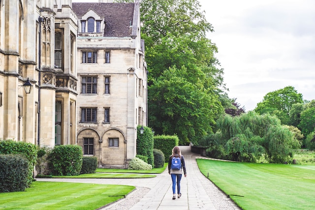 Study Abroad Public Schools Scholarships for International Students; Video and Images/Photos. Public Schools Images/Photos: 4. A photo of student walking along the concrete road of a school building at King's College, University of Cambridge, Cambridge, United Kingdom. Photo by Victoria Heath on Unsplash